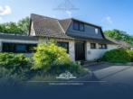 Titelbild - Einfamilienhaus mit Kamin, Bar und Doppelgarage in traumhafter Feldrandlage von Garbsen