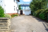 Hofeinfahrt - Gepflegtes Mehrfamilienhaus mit 3 Wohneinheiten – attraktive Kapitalanlage in Wunstorf
